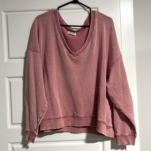 Distressed pink V-neck sweater from American eagle sized large